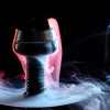a hookah with smoke coming out of it