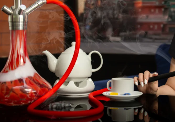 Collection of modern hookah accessories including bowl and hose
